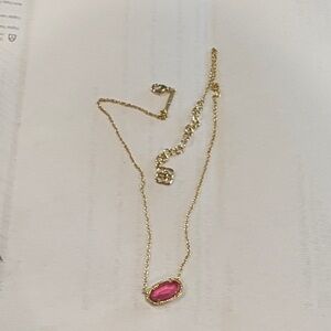 Kendra Scott gold necklace with pink stone